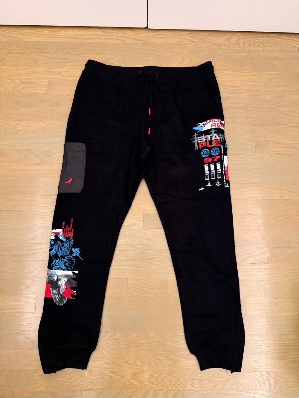 Staple Black Jogger Pants with Red and Blue Graphic Accents